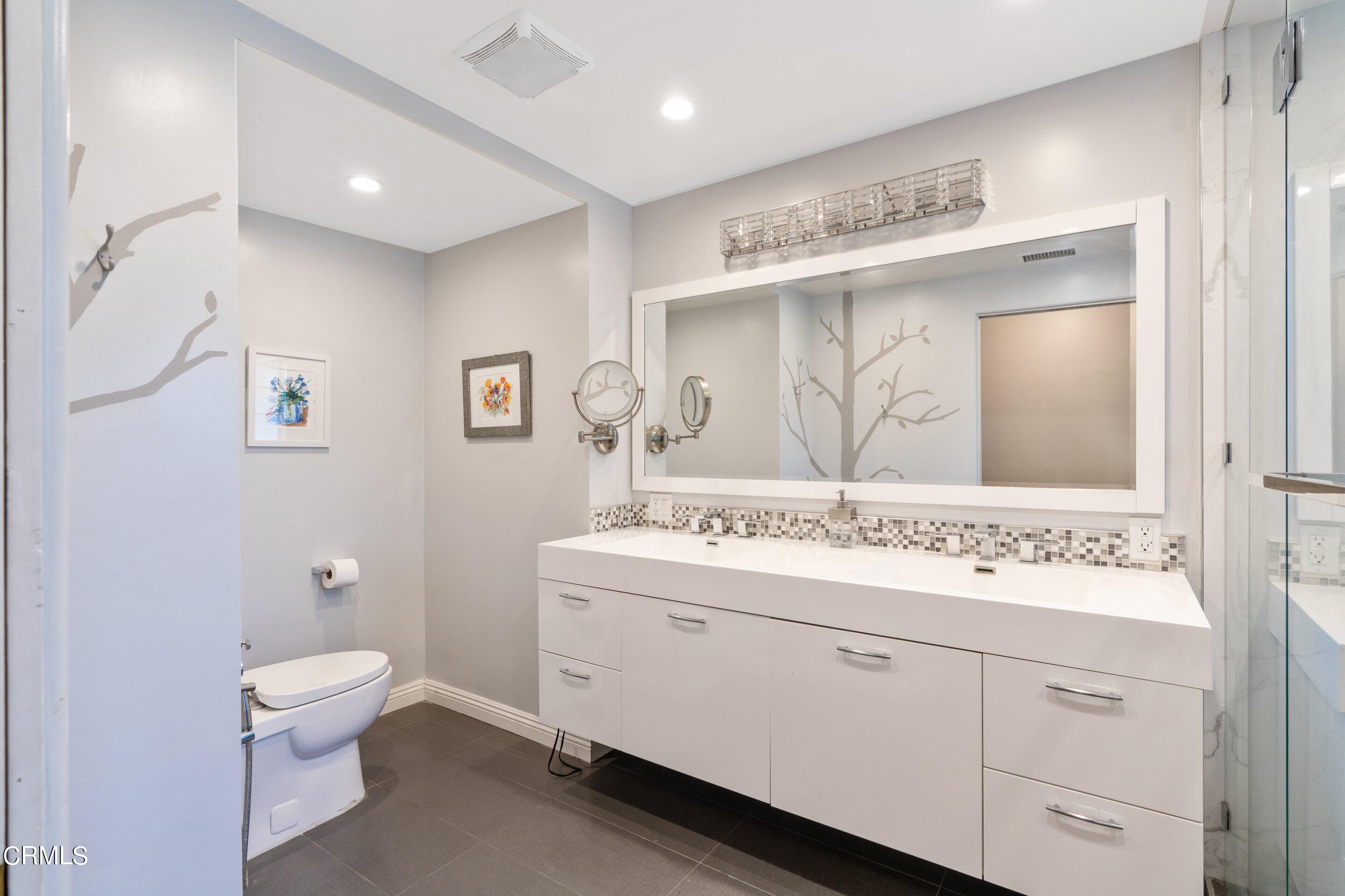 343 Cherry Drive Pasadena, CA 91105 - Photo 16 of 33 a bathroom with a toilet sink and mirror