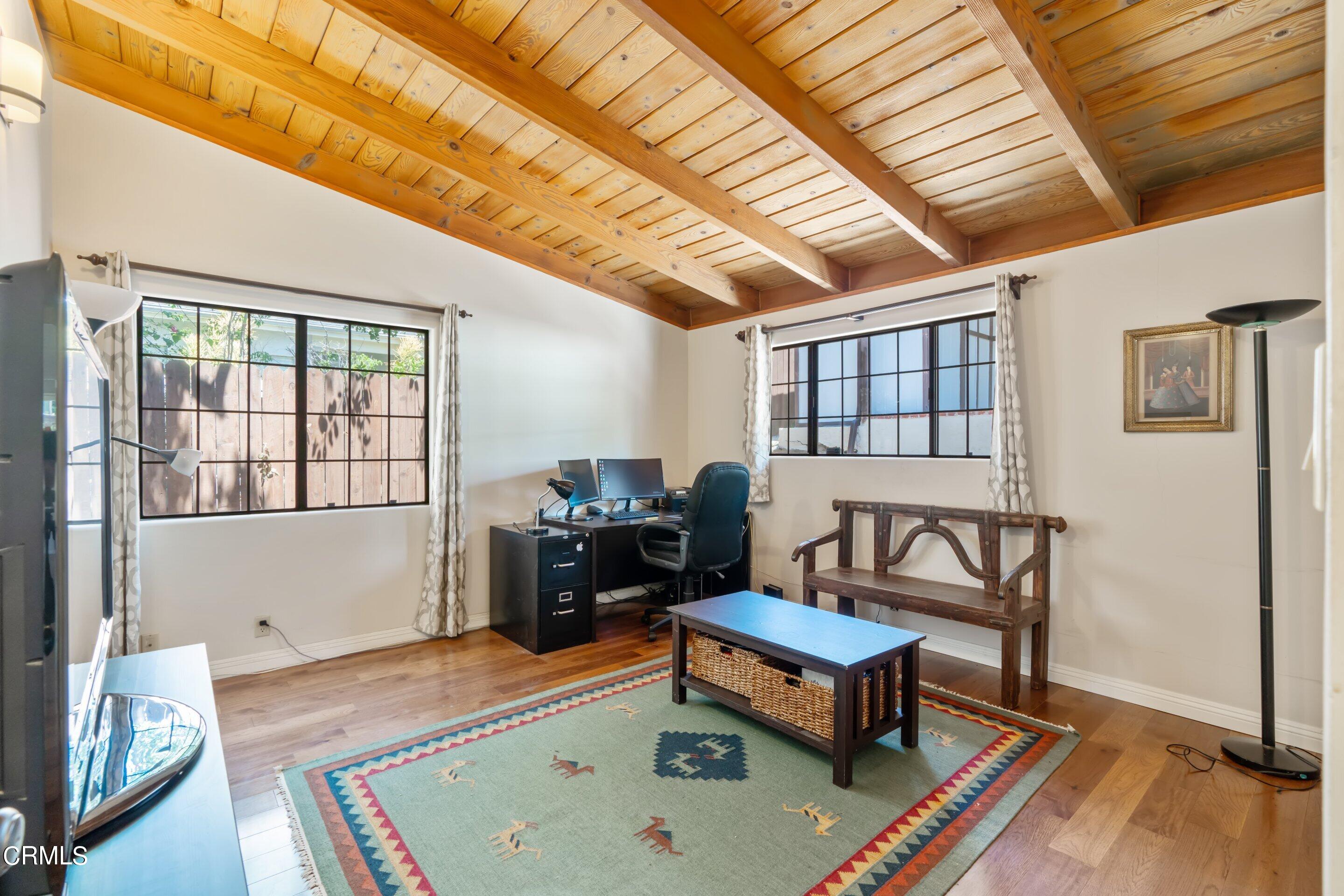 343 Cherry Drive Pasadena, CA 91105 - Photo 18 of 33 a living room with furniture and a wooden floor