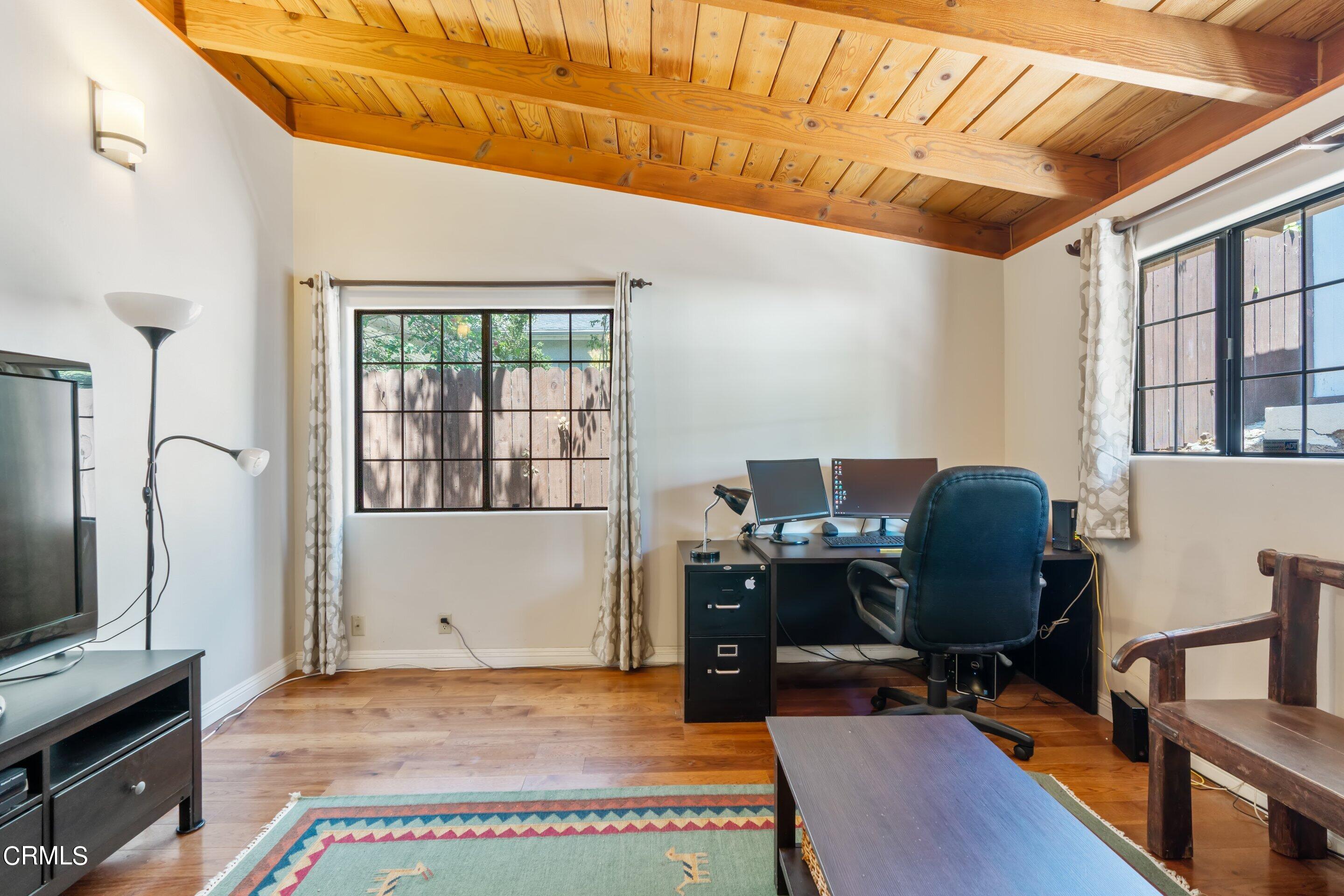 343 Cherry Drive Pasadena, CA 91105 - Photo 19 of 33 a view of a workspace with furniture and a window
