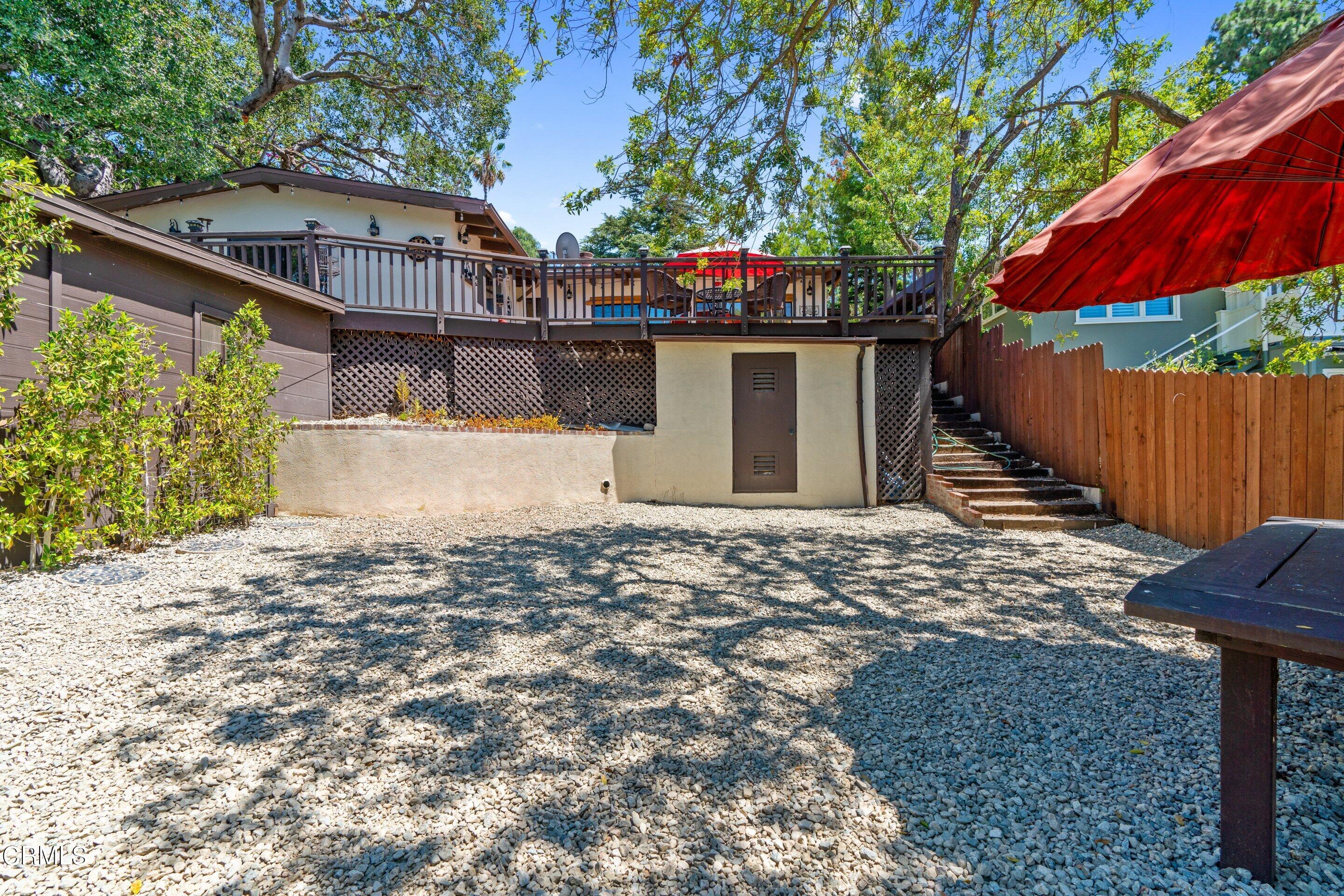 343 Cherry Drive Pasadena, CA 91105 - Photo 27 of 33 a view of a house with a yard and wooden fence