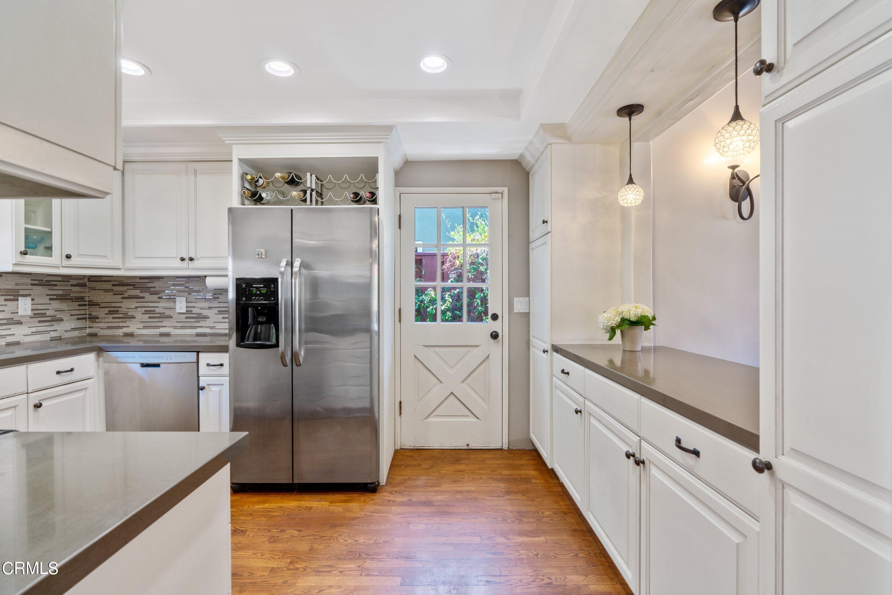 343 Cherry Drive Pasadena, CA 91105 - Photo 6 of 33 a large kitchen with granite countertop a refrigerator and a sink