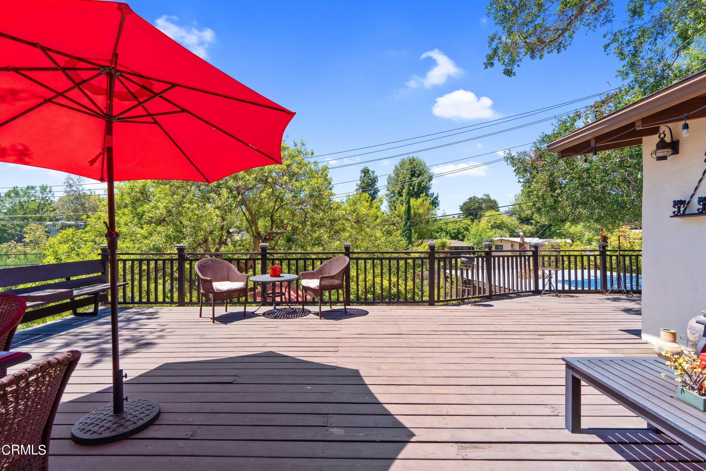 343 Cherry Drive Pasadena, CA 91105 - Photo 9 of 33 a view of a balcony with wooden floor and outdoor seating