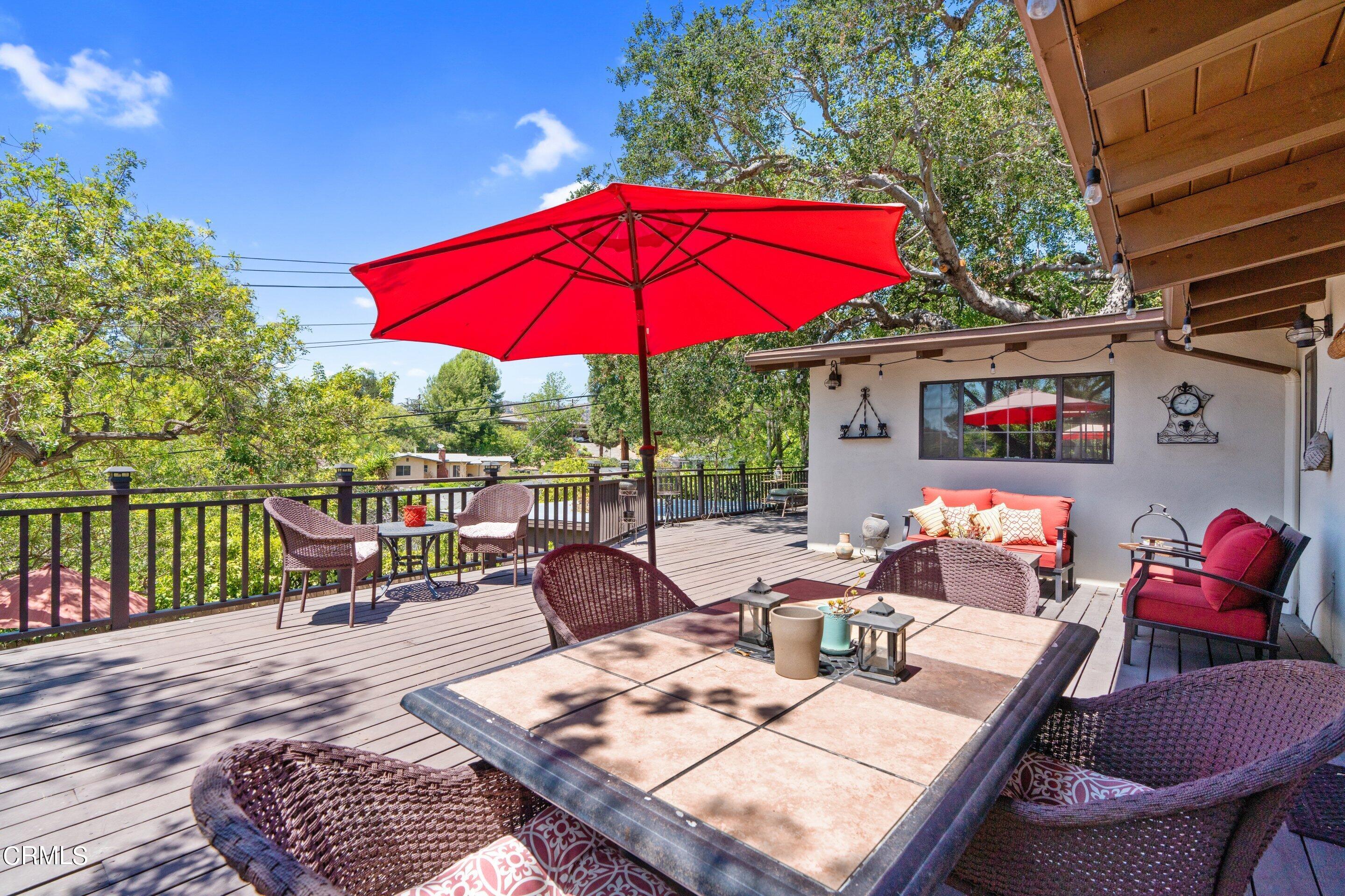 343 Cherry Drive Pasadena, CA 91105 - Photo 10 of 33 a view of balcony with outdoor seating and wooden floor
