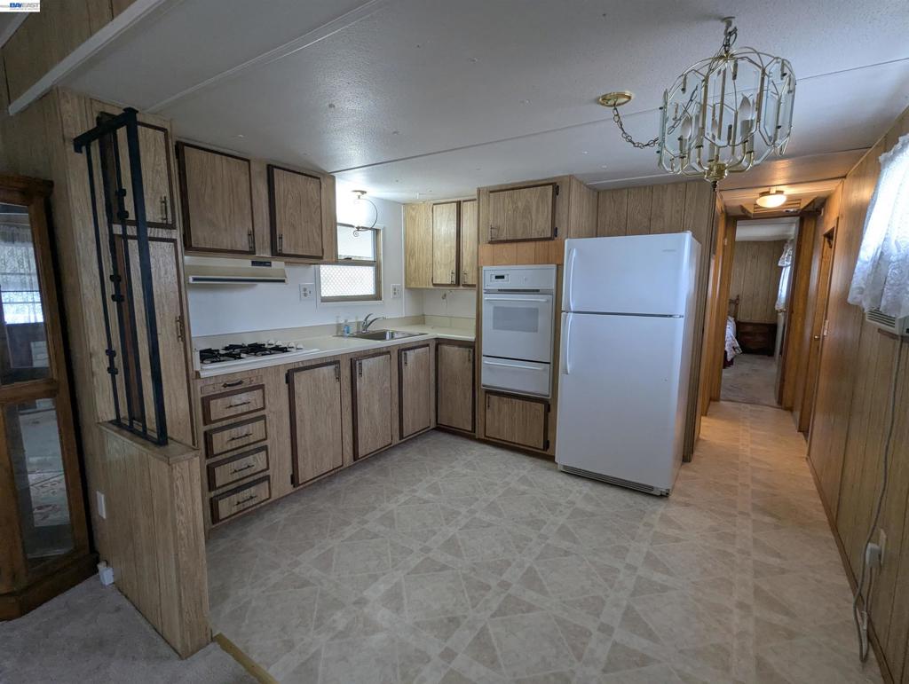 3913 Castro Valley Boulevard Castro Valley, CA 94546 - Photo 13 of 33 a kitchen with stainless steel appliances a refrigerator a stove a sink dishwasher a oven with a island and cabinets