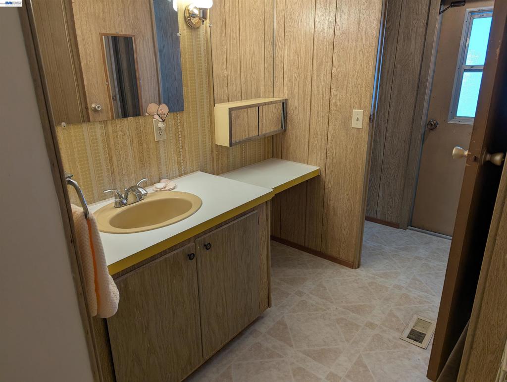 3913 Castro Valley Boulevard Castro Valley, CA 94546 - Photo 23 of 33 a bathroom with a sink a mirror and a toilet