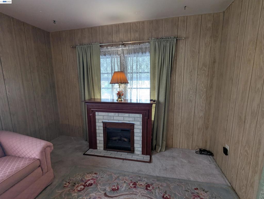 3913 Castro Valley Boulevard Castro Valley, CA 94546 - Photo 6 of 33 a living room with furniture and a fireplace