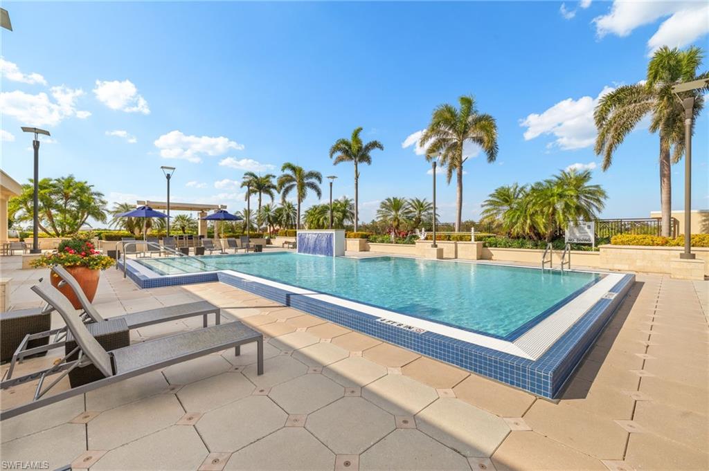 9123 Strada Place, Unit 7316 Naples, FL 34108 - Photo 35 of 47 Community pool featuring a patio area