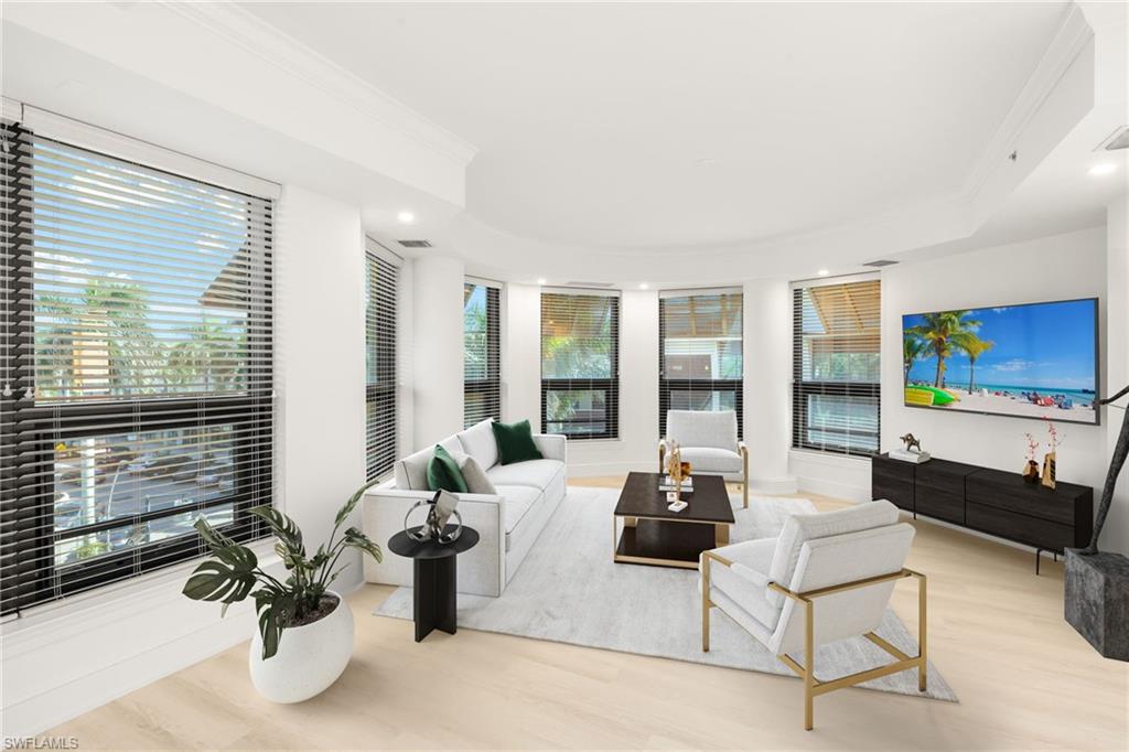 9123 Strada Place, Unit 7316 Naples, FL 34108 - Photo 9 of 47 Living room with crown molding, light wood-style flooring, and recessed lighting