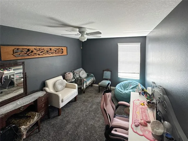 a bed room with a bed and a couch