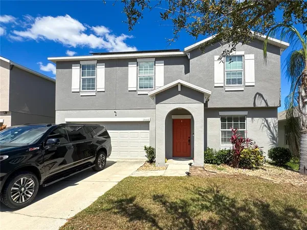 a aerial view of a house with a yard