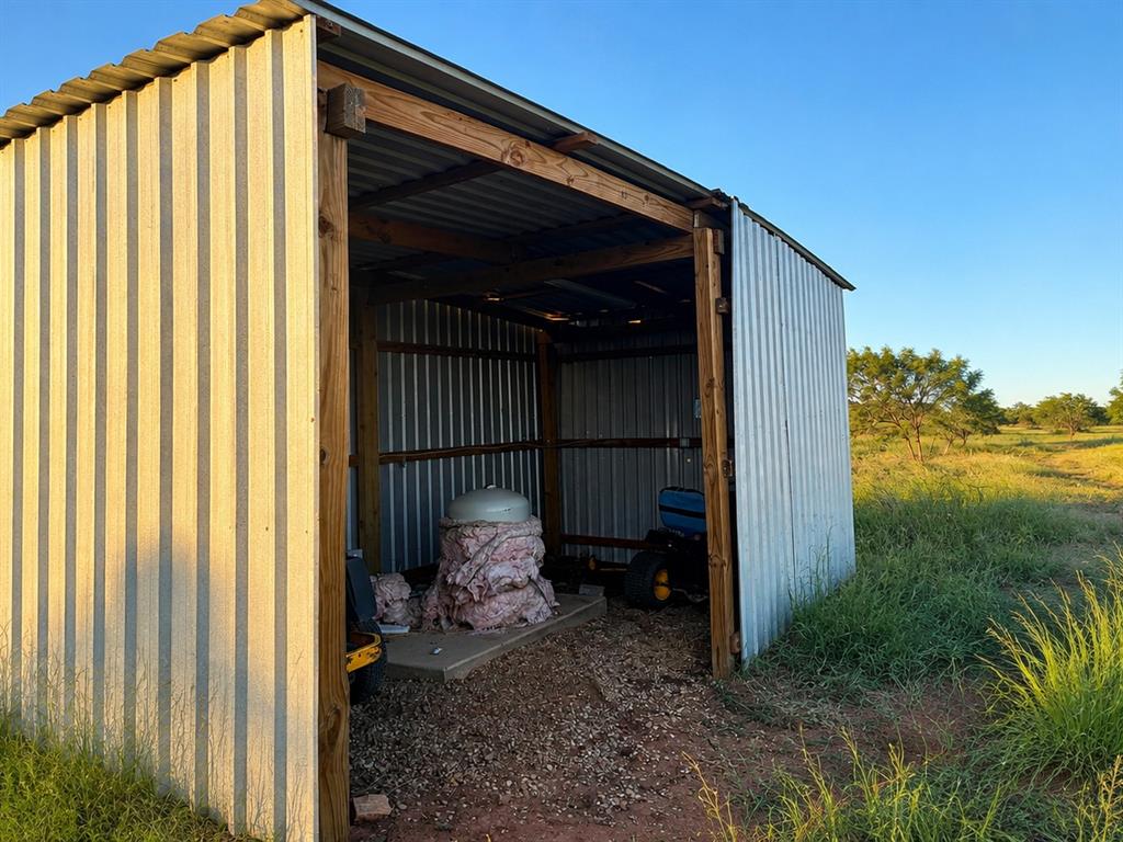 14214 County Road 421 Merkel, TX 79536 - Photo 10 of 16 Metal outbuilding, offering additional Co Reed storage space to protect the Water well.