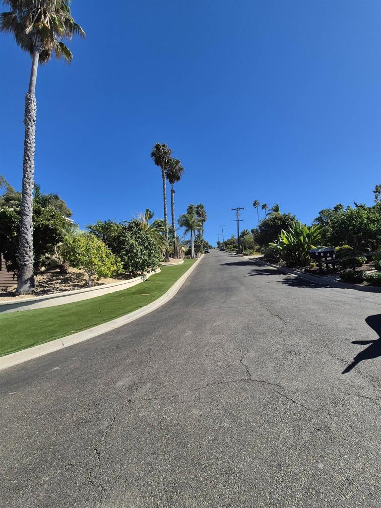 5665 Toyon Road San Diego, CA 92115 - Photo 17 of 19 a view of a road with a building in the background