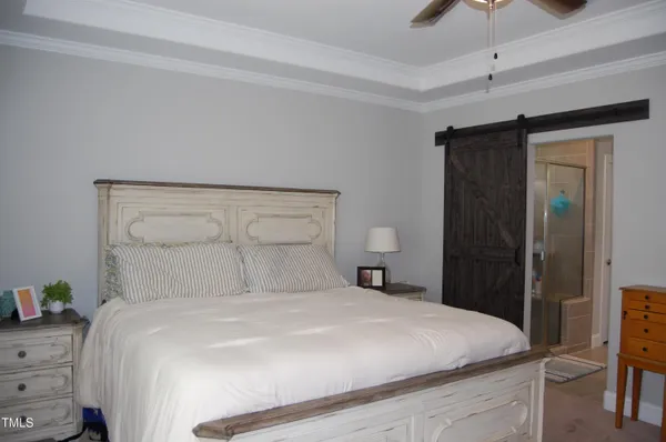 a bedroom with a bed and a closet