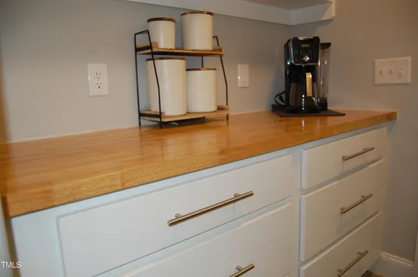 a view of room with wooden floor