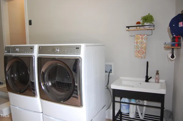 a view of a storage & utility room with washer and dryer