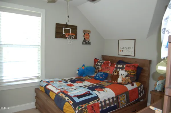 a bedroom with a bed and closet