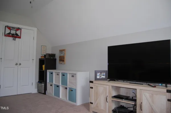 a view of a dining room with furniture and toys