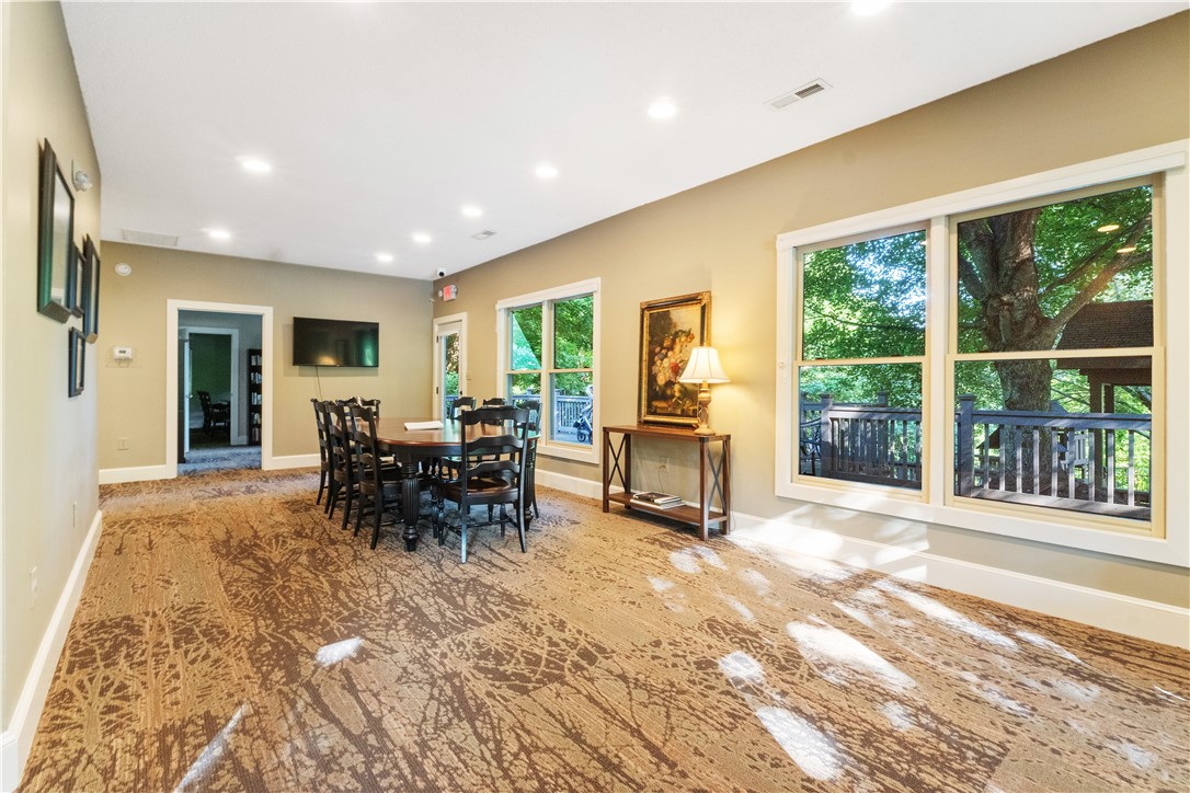 39 Raptor Way Landrum, SC 29356 - Photo 13 of 50 Bright and inviting space for gatherings with abundant natural light and an expansive view.