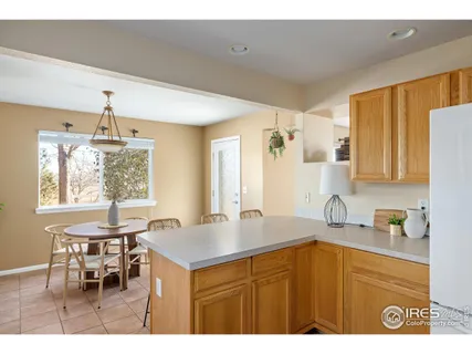 a kitchen with a sink cabinets and window