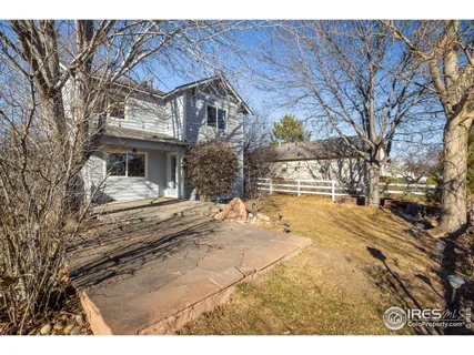 a view of a tables and chairs in the yard