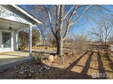 a view of a garden with a building