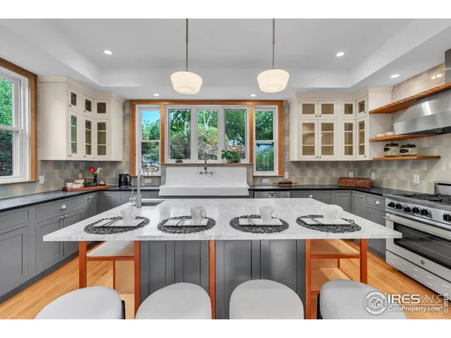 a kitchen with furniture a window and appliances