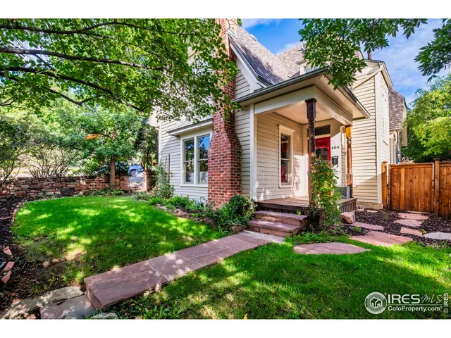 a view of backyard with a garden and entertaining space