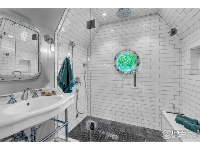 a bedroom with a bed and a lamp