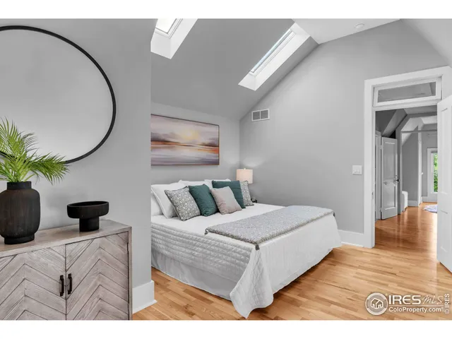 a bathroom with a toilet sink a mirror and shower