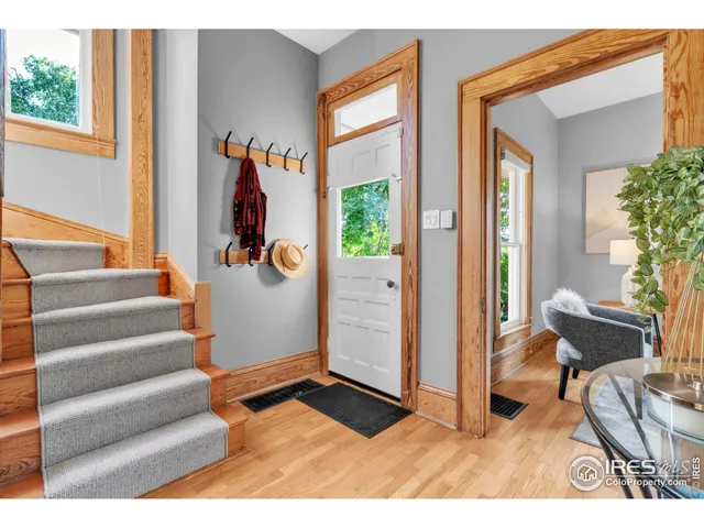 a view of an entryway with wooden floor