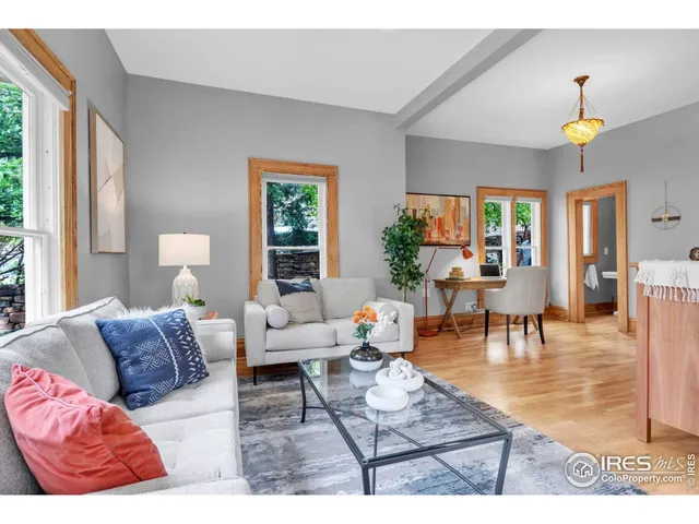 a living room with furniture and a table