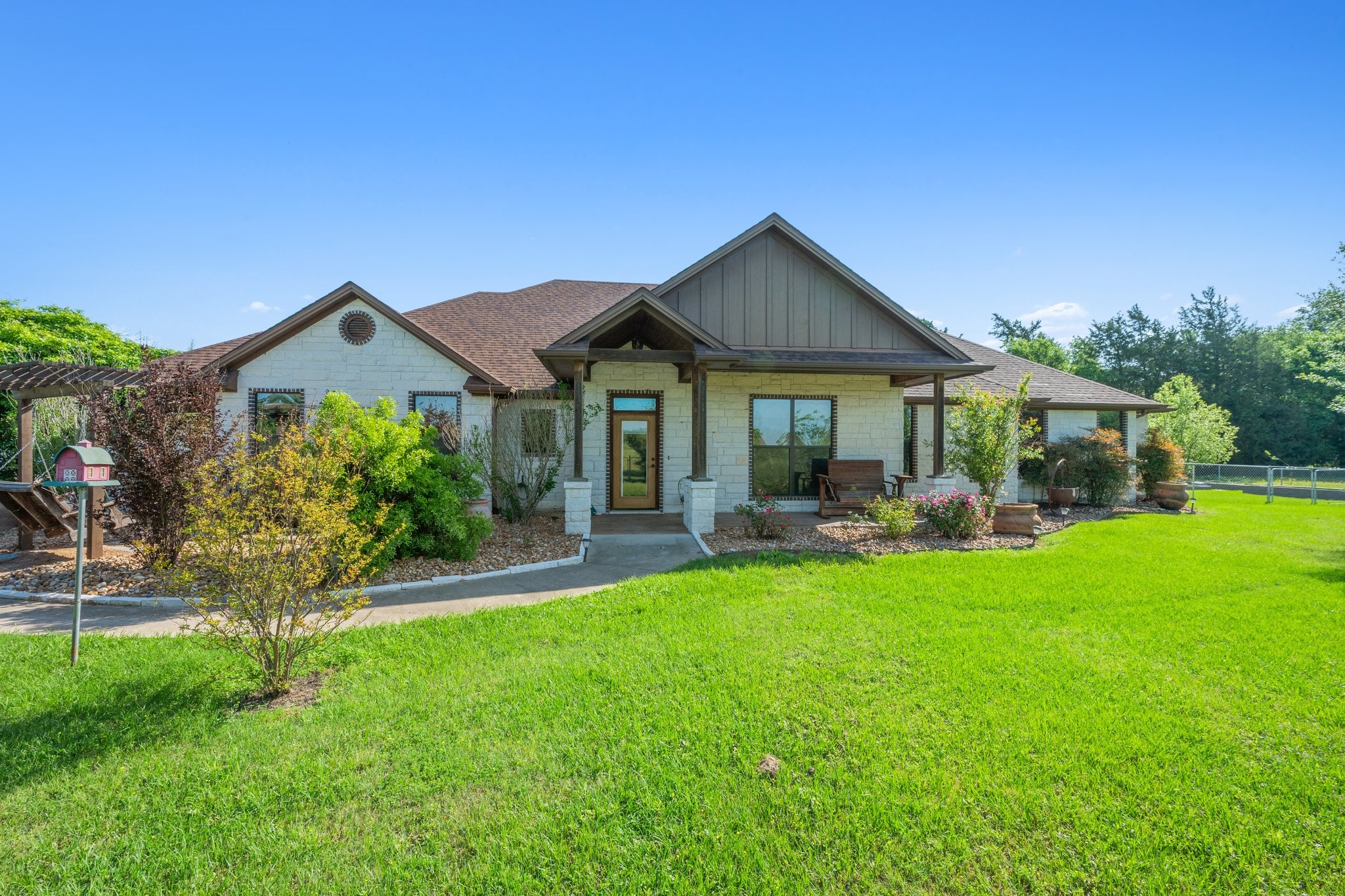 7754 Edge Cut Off Road Hearne, TX 77859 - Photo 1 of 50 a front view of a house with swimming pool having outdoor seating