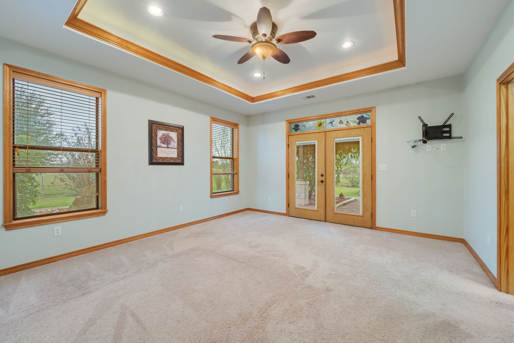 7754 Edge Cut Off Road Hearne, TX 77859 - Photo 13 of 50 an empty room with windows and fan