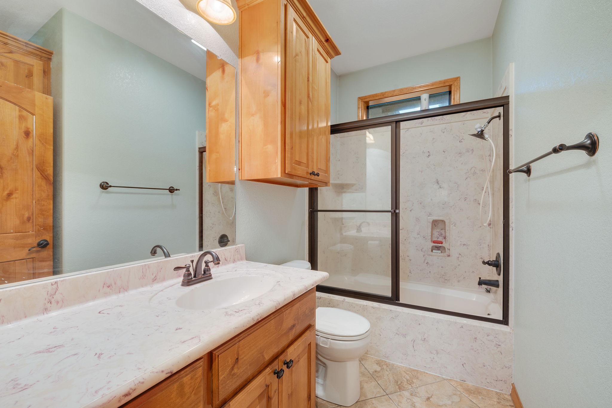 7754 Edge Cut Off Road Hearne, TX 77859 - Photo 21 of 50 a bathroom with a granite countertop sink toilet and shower