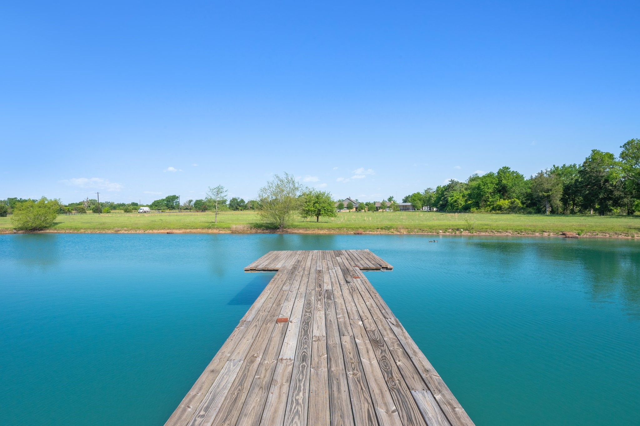 7754 Edge Cut Off Road Hearne, TX 77859 - Photo 27 of 50 a view of lake with a table and chairs