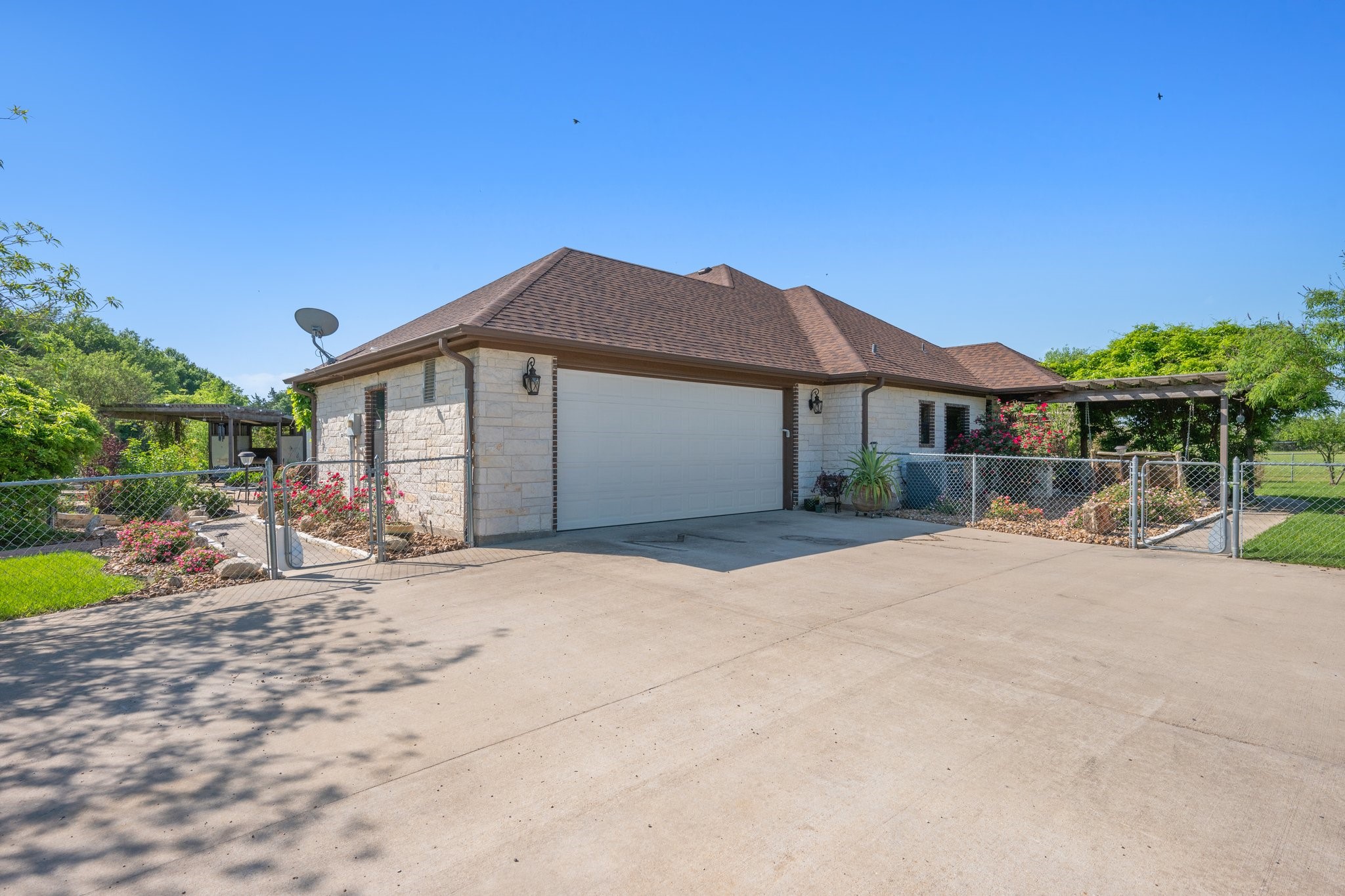 7754 Edge Cut Off Road Hearne, TX 77859 - Photo 35 of 50 a front view of a house with a garden and yard