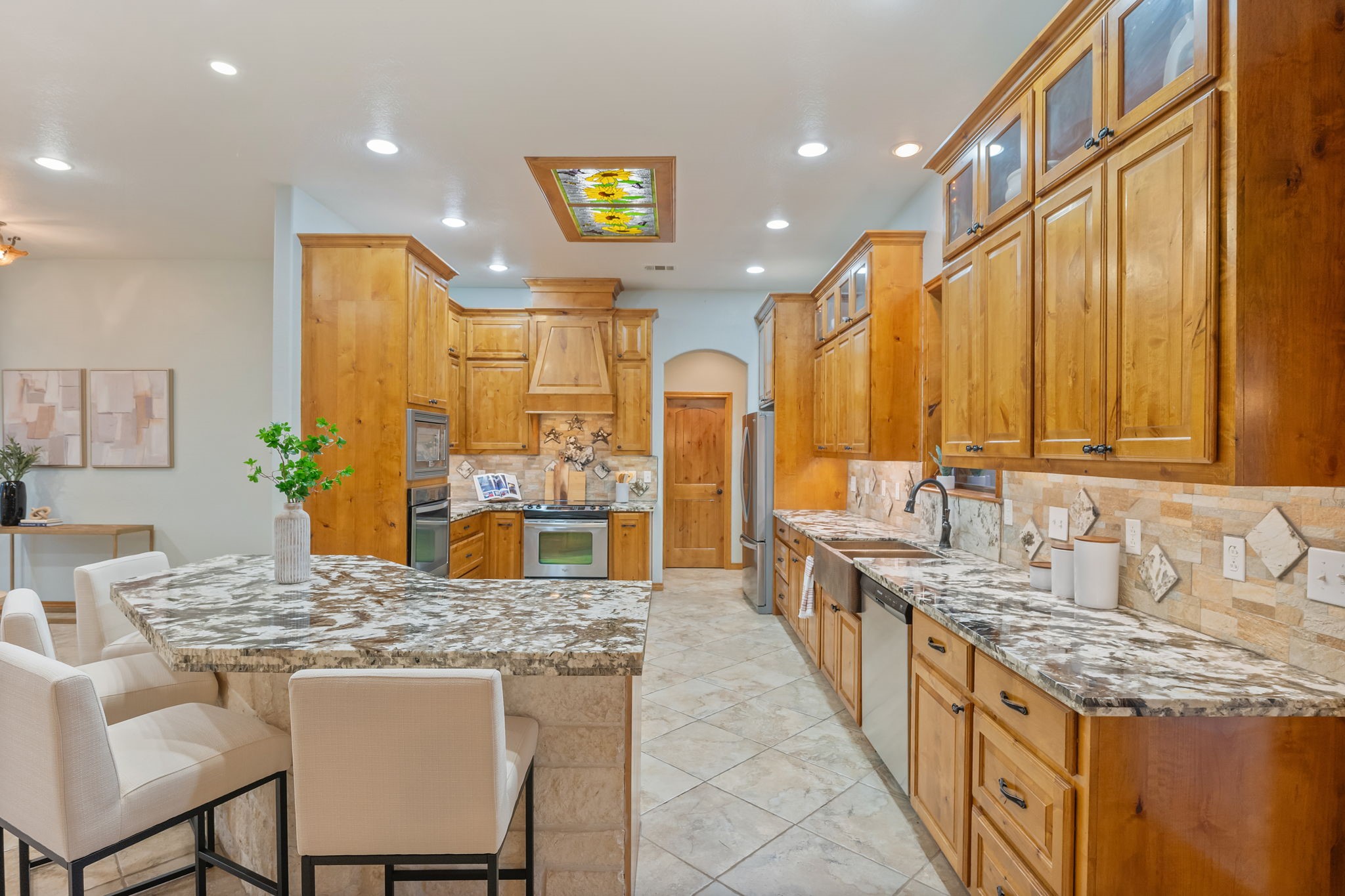 7754 Edge Cut Off Road Hearne, TX 77859 - Photo 8 of 50 a kitchen with kitchen island granite countertop a sink and counter space