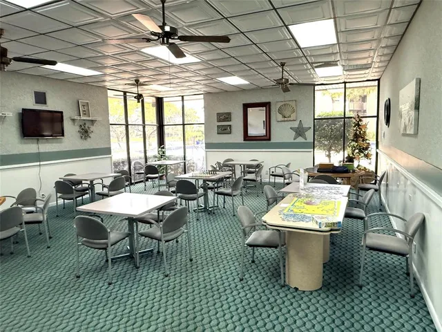 a view of kitchen with granite countertop sink and wooden floor