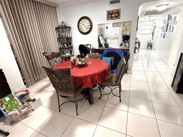 a bed room with a bed and flat tv screen