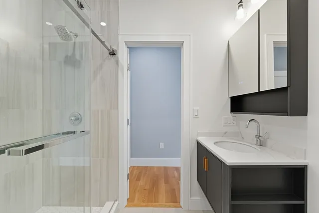 a bathroom with a sink and a mirror