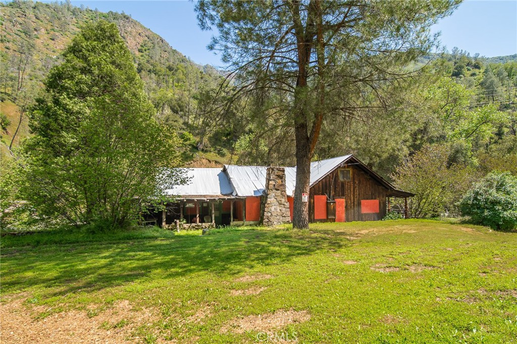 10049 Incline Road El Portal, CA 95318 - Photo 4 of 44 a view of a house with a big yard and large trees