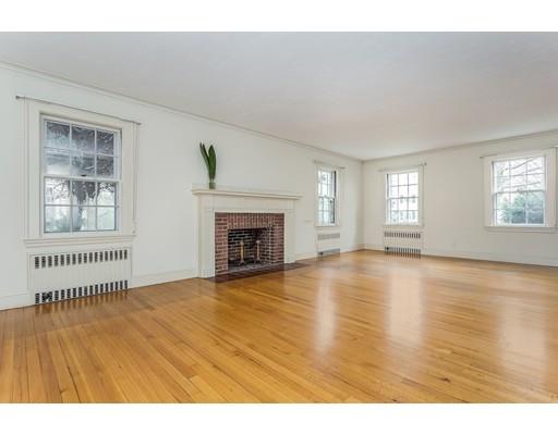 16 Rutledge Road Belmont, MA 02478 - Photo 4 of 14 a view of empty room with wooden floor and fireplace