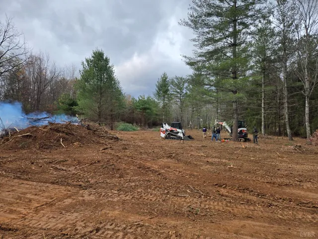 a view of outdoor space with playground and green space