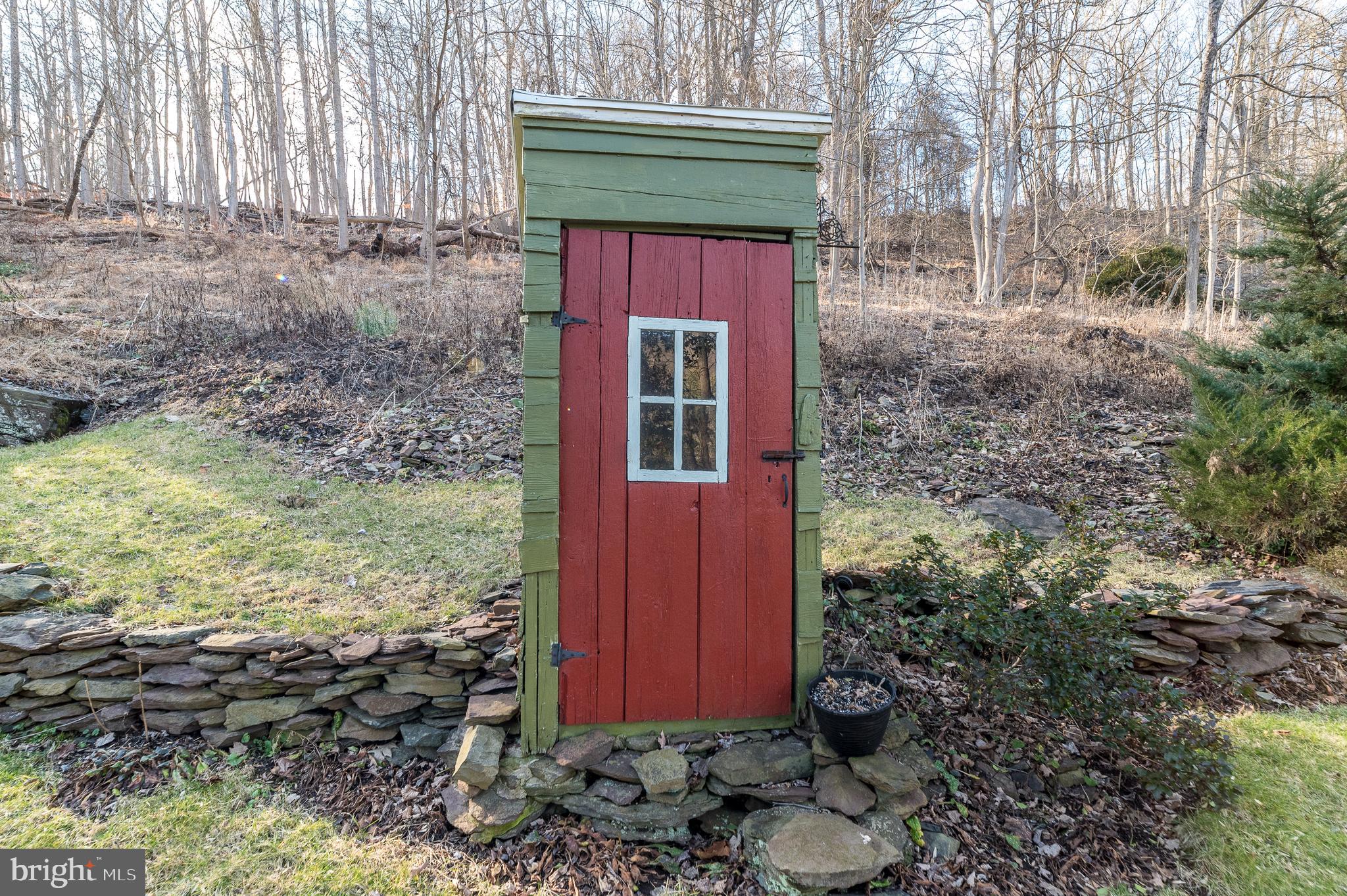 213 River Road Pipersville, PA 18947 - Photo 32 of 37 The outhouse offers historic charm
