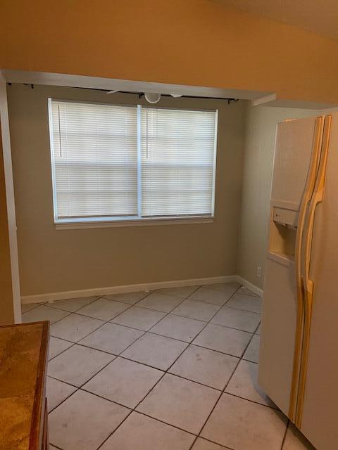 702 Northwest 8th Court Boynton Beach, FL 33426 - Photo 3 of 10 a view of an empty room with a window