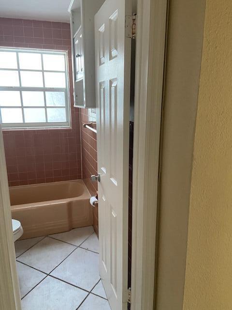 702 Northwest 8th Court Boynton Beach, FL 33426 - Photo 6 of 10 a bathroom with a bathtub and a shower