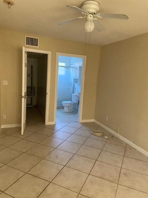 702 Northwest 8th Court Boynton Beach, FL 33426 - Photo 8 of 10 a view of a room with a chandelier fan and fire place