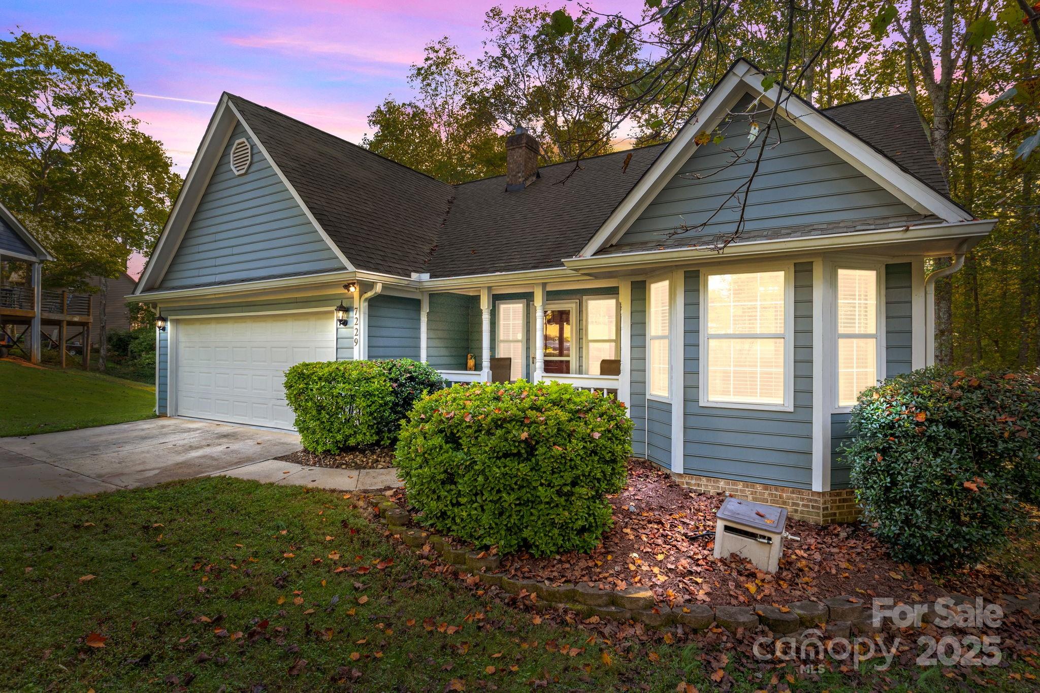 7229 Catawba Springs Road Denver, NC 28037 - Photo 1 of 48 a front view of a house with garden
