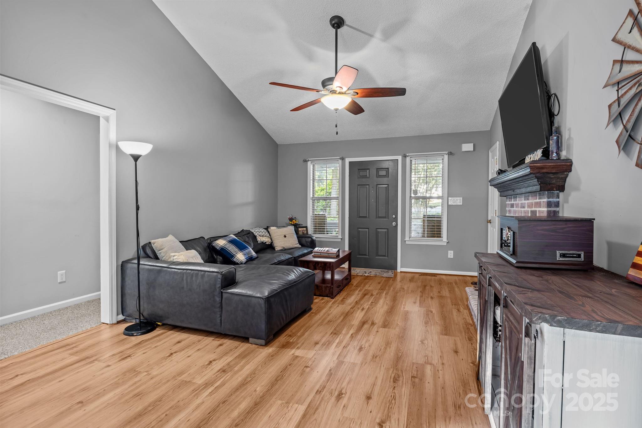 7229 Catawba Springs Road Denver, NC 28037 - Photo 12 of 48 a living room with furniture and a flat screen tv