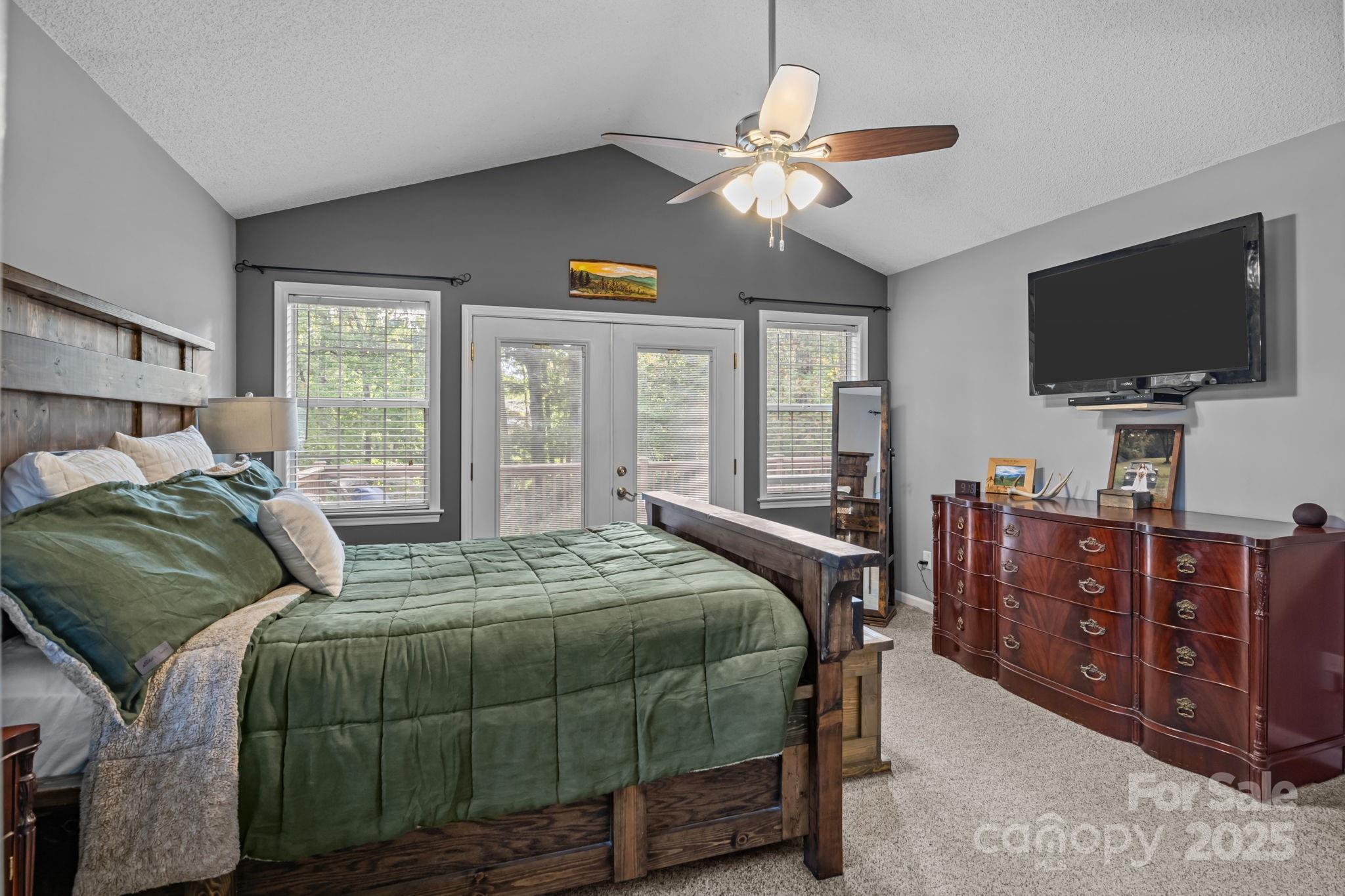 7229 Catawba Springs Road Denver, NC 28037 - Photo 25 of 48 a bedroom with a bed and a flat screen tv